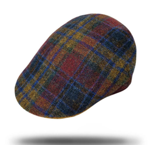 A classic flat cap in a multicolor plaid pattern featuring red, blue, yellow, and brown tones, shown floating against a white background with a soft shadow underneath.