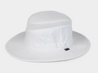 A white wide-brim sun hat with a mesh band around the crown and a small black Tilley Logo the side, photographed against a light gray studio background.